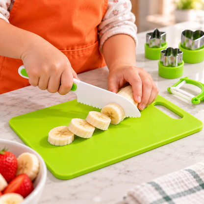 Close-up of a child using a kid-friendly knife from the kit